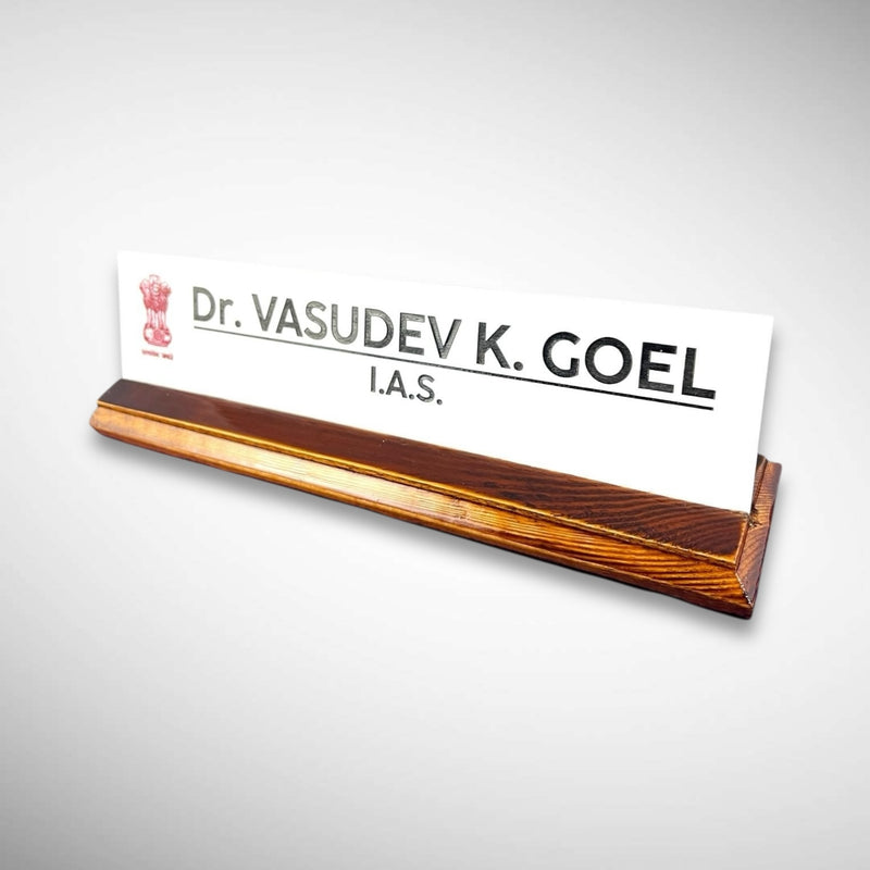 A premium desk nameplate featuring a polished wooden base with a sleek acrylic | Dr. Vasudev Goel