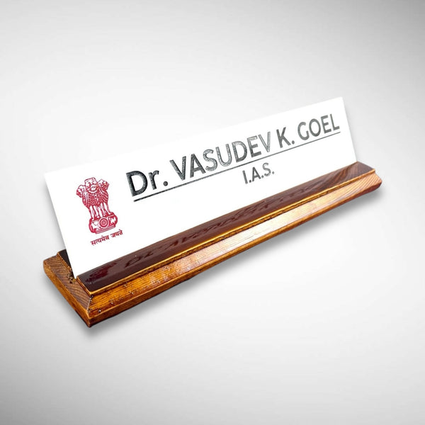 A premium desk nameplate featuring a polished wooden base with a sleek acrylic | Dr. Vasudev Goel