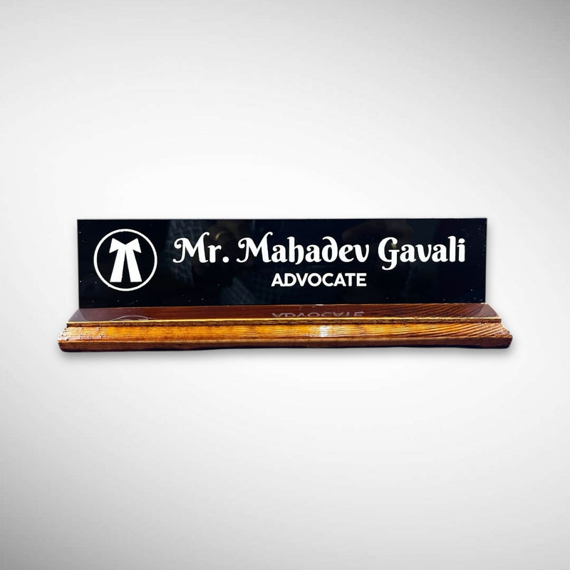A premium desk nameplate featuring a polished wooden base with a sleek acrylic | Adv. Mahadev Gavali