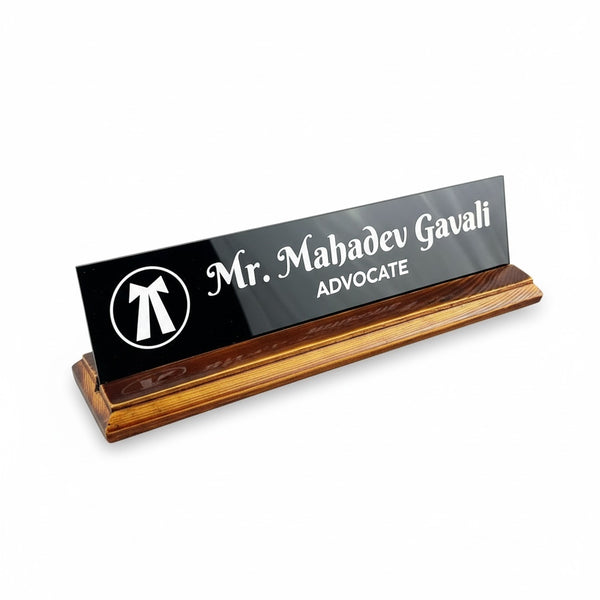 A premium desk nameplate featuring a polished wooden base with a sleek acrylic | Adv. Mahadev Gavali