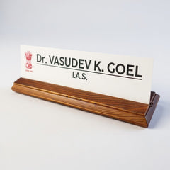 A premium desk nameplate featuring a polished wooden base with a sleek acrylic | Dr. Vasudev Goel