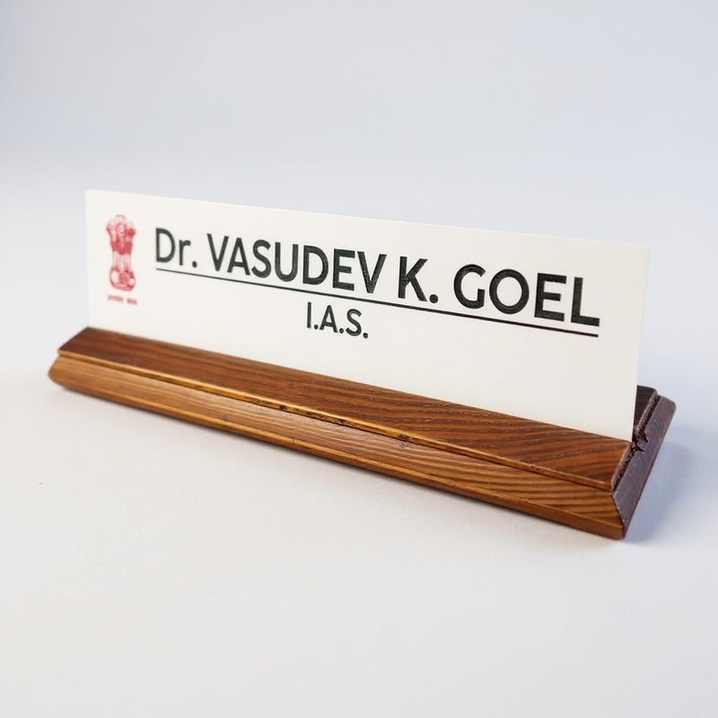 A premium desk nameplate featuring a polished wooden base with a sleek acrylic | Dr. Vasudev Goel
