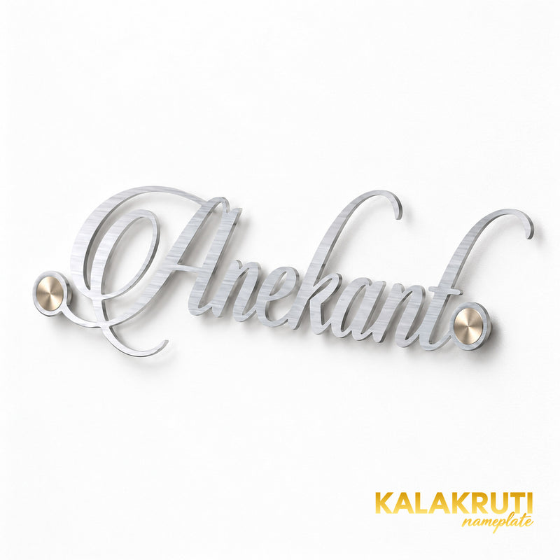 Anekant silver-tone script nameplate from the right, with the right end nearer the camera