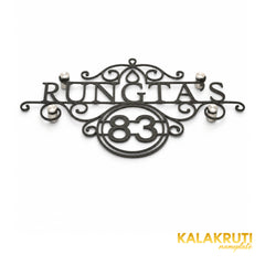 Rungta's 83 black nameplate, oblique detail showing thin cutout edges and four metallic stand-offs