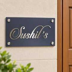 Sushil's nameplate shown installed at a residential entrance