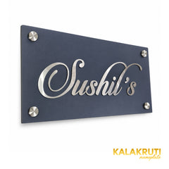 Sushil's left angle of the nameplate on a white studio background