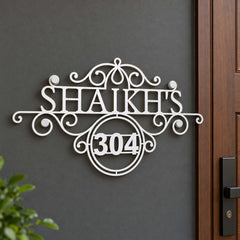 Shaikh's nameplate shown installed at a residential entrance
