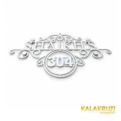 Shaikh's nameplate, original low oblique view of the scrollwork and integrated 304 frame