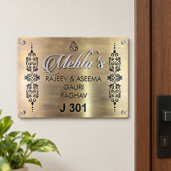 Mehta's nameplate shown installed at a residential entrance