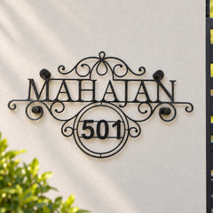 Mahajan nameplate shown installed at a residential entrance