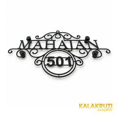 Mahajan nameplate, original low oblique view showing the textured black scrollwork and 501 frame
