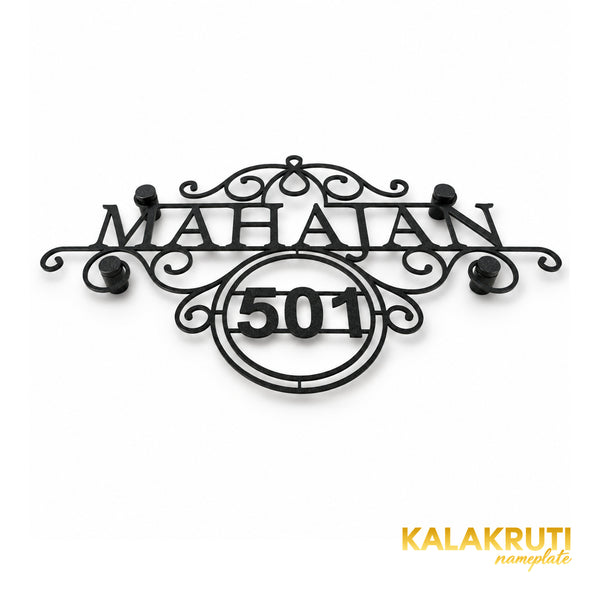 Mahajan nameplate, original low oblique view showing the textured black scrollwork and 501 frame