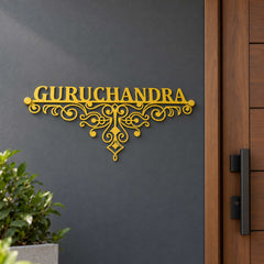 Guruchandra nameplate shown installed at a residential entrance