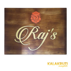 Raj’s wooden LED nameplate with gold script and orange Ganesh - front LED off