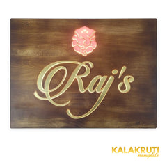 Raj’s wooden LED nameplate with gold script and orange Ganesh - front LED on