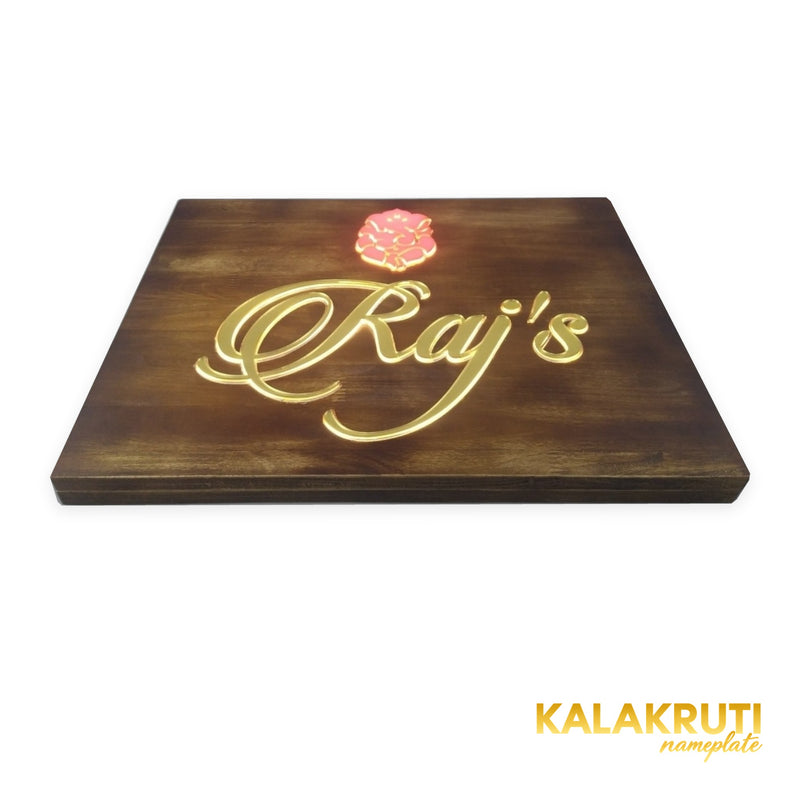 Raj’s wooden LED nameplate with gold script and orange Ganesh - low angle LED on