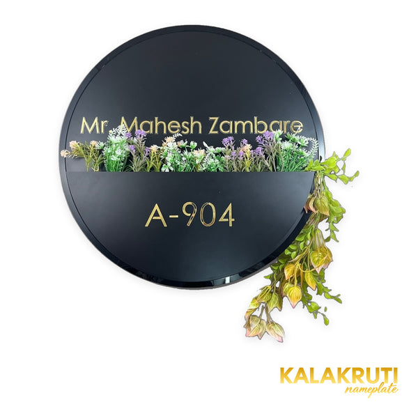 Mr. Mahesh Zambare A-904 round black floral planter nameplate - front