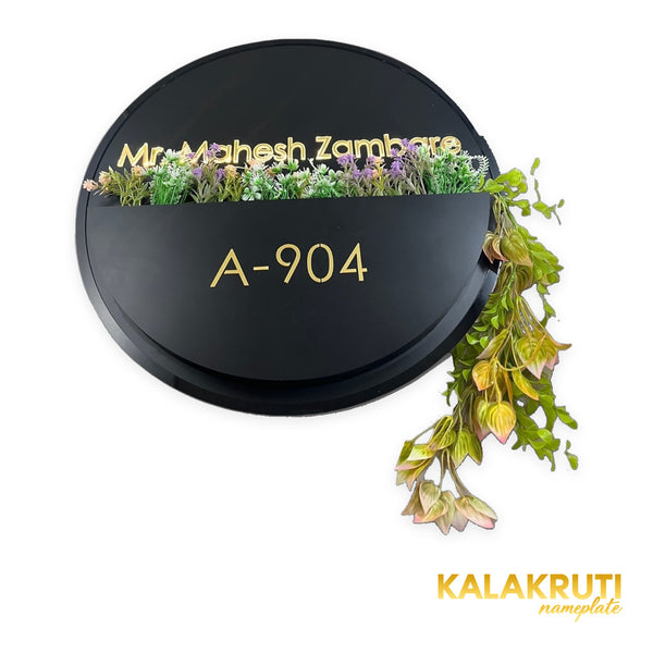 Mr. Mahesh Zambare A-904 round black floral planter nameplate - elevated angle