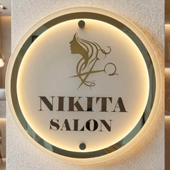 Nikita Salon round layered LED sign — Supplied installed salon scene, warm LED on