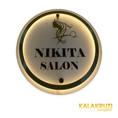 Nikita Salon round layered LED sign — Front warm LED on in low ambient light
