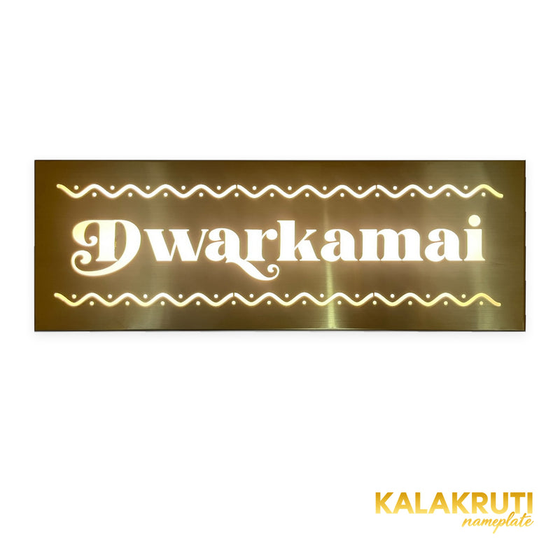 Dwarkamai brushed brass-gold LED nameplate — Front warm LED on