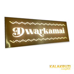 Dwarkamai brushed brass-gold LED nameplate — Left angle warm LED on
