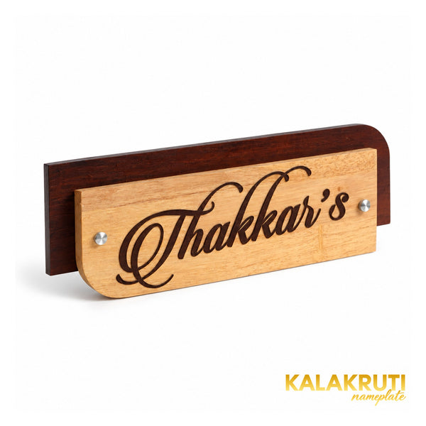 Thakkar’s wooden nameplate, left angle