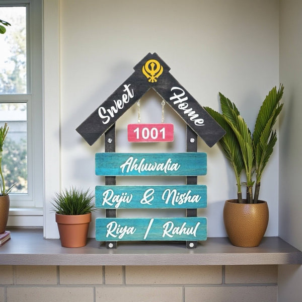 Black and Teal House Shape Wooden Nameplate | Ahluwalia — installed hero (KKWN0023)