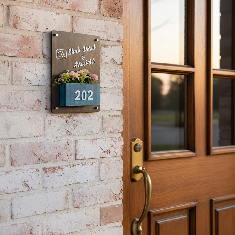 Dark Wood Office Planter Nameplate | Shah Desai & Associates — installed hero (KKWN0025_A)