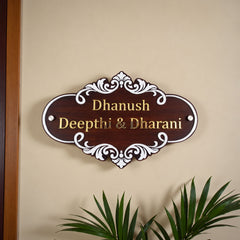 White Scroll Wooden Nameplate | Dhanush, Deepthi & Dharani — installed hero (KKWN0031_A)