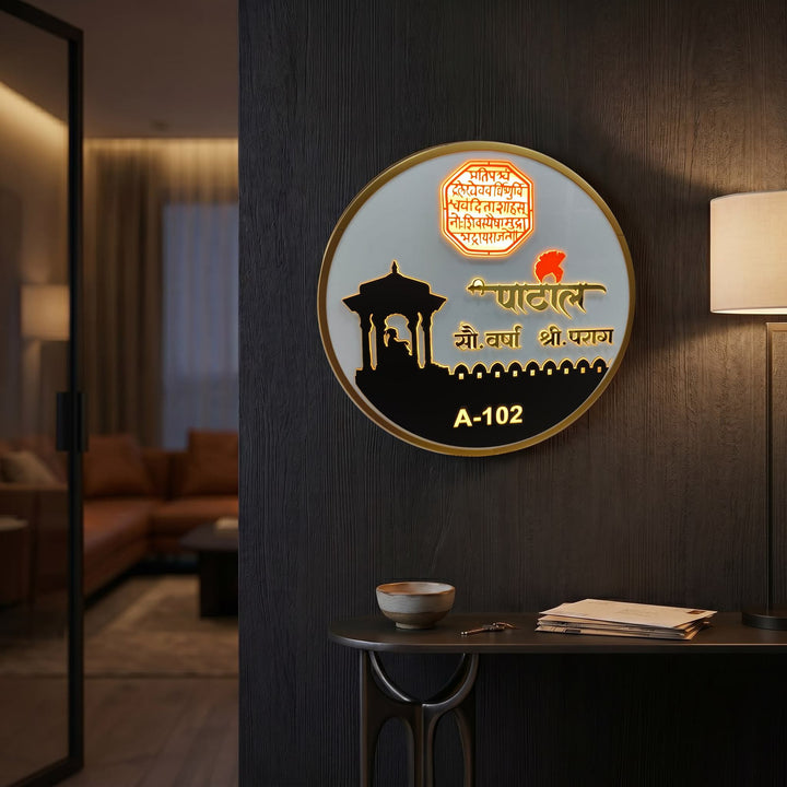 Patil A-102 round LED nameplate — Supplied installed scene, warm LED on
