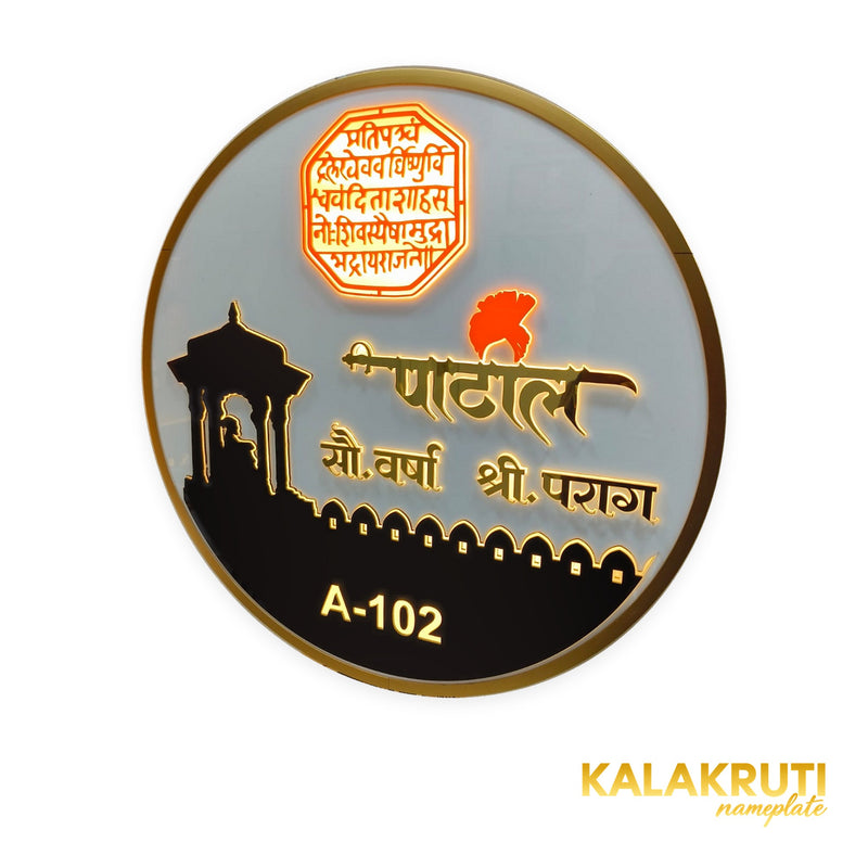 Patil A-102 round LED nameplate — Supplied oblique warm LED-on view