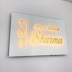 Mira & Ashutosh Sharma 101 white acrylic LED nameplate — Installed warm LED on