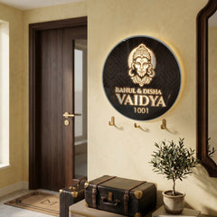 Vaidya 1001 Hanuman round LED nameplate — Supplied installed scene, warm LED on