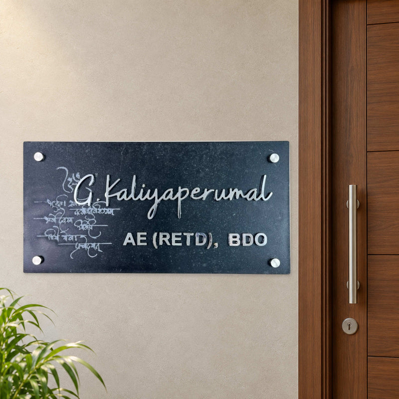 G Kaliyaperumal nameplate shown installed beside an indoor apartment entrance door