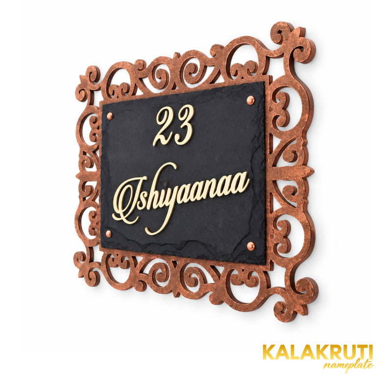 Ishiyaanaa black stone nameplate, right angle showing the ornate MDF frame and cream acrylic lettering
