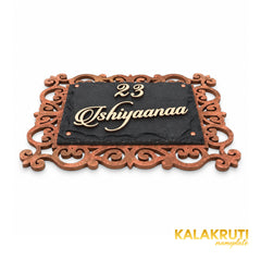 Ishiyaanaa nameplate, low angle showing the cream acrylic letters and layered stone and MDF construction