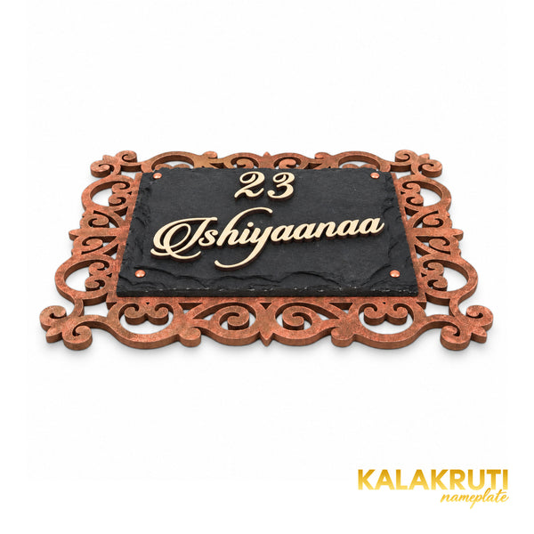 Ishiyaanaa nameplate, low angle showing the cream acrylic letters and layered stone and MDF construction