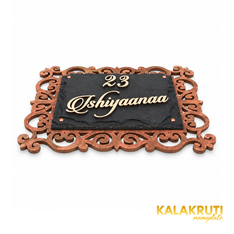 Ishiyaanaa nameplate, low angle showing the cream acrylic letters and layered stone and MDF construction