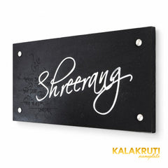 Shreerang black slate nameplate, right oblique view retaining the original mantra engraving and stainless steel script