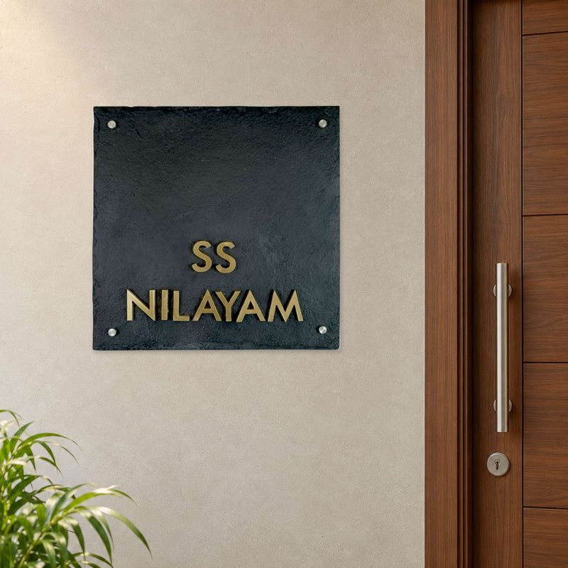 SS Nilayam nameplate shown installed beside an indoor apartment entrance door