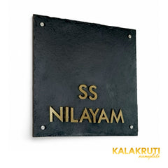SS Nilayam square black stone nameplate, left angle retaining original brass lettering and spacious upper layout
