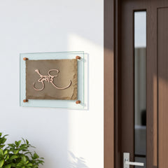 Desai sandstone and copper nameplate, installed beside an apartment entrance door
