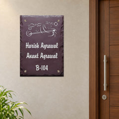 Harish and Anant Agrawal engraved brown stone nameplate shown installed beside an apartment entrance door