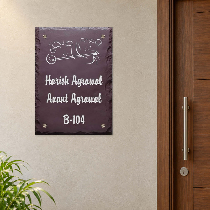 Harish and Anant Agrawal engraved brown stone nameplate shown installed beside an apartment entrance door