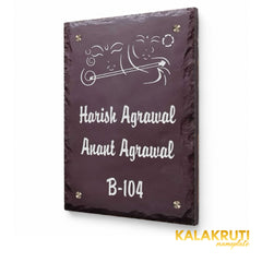 Harish and Anant Agrawal engraved brown stone nameplate, right angle showing the chipped rim and original white flute artwork