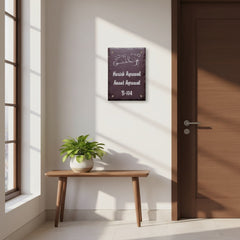 Harish and Anant Agrawal engraved nameplate installed beside an apartment entrance, wider view with window and console