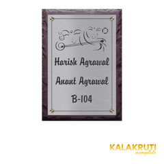 Harish & Anant Agrawal — Etched Steel nameplate, level front view on a white studio background
