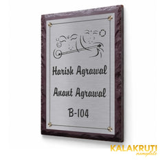 Harish and Anant Agrawal etched stainless steel and brown stone nameplate, right angle showing the steel panel fitted directly against the stone