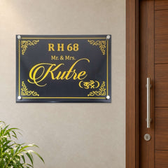 Kutre nameplate shown installed beside an indoor apartment entrance door